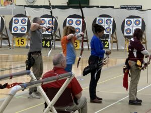 Four archers at the line at Indoor Nationals.